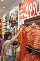 Japan, Honshu, Kanto, Tokyo, Shinjuku, Clothing Store Sales Girl at Uniqlo [PST110004169]