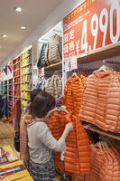 Japan, Honshu, Kanto, Tokyo, Shinjuku, Clothing Store Sales Girl at Uniqlo [PST110004170]