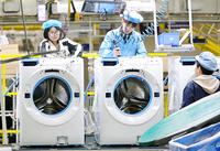 Workers assemble washers on the production line at a Haier factory in Qingdao in east China's Shandong province Sunday, Feb. 18, 2024. [PST110004173]