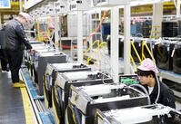 Workers assemble washers on the production line at a Haier factory in Qingdao in east China's Shandong province Sunday, Feb. 18, 2024. [PST110004174]