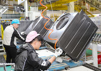 Workers assemble washers on the production line at a Haier factory in Qingdao in east China's Shandong province Sunday, Feb. 18, 2024. [PST110004176]