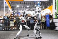 Viewers watch the humanoid robot fighting competition at WORLD INTELLIGENCE EXPO 2025 in Chongqing, China on September 5, 2025. [PST110004185]