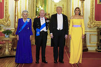 King Charles III and Queen Camilla stand with US President Donald Trump and First Lady Melania Trump arrive for the state banquet at Windsor Castle, Berkshire [PST110004201]
