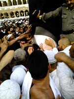 Muslims jostle for a chance to touch the black stone embedded in the eastern corner of the Kaaba, Grand Mosque, Mecca, Saudi Arabia. [PST110004337]