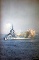 OKINAWA, JAPAN - 01 April 1945 - The USS Idaho (BB-42) fires the 14/50 guns of Turret Three at nearly point-blank range into a Japanese Imperial Navy ship during the bombardment of Okinawa, 1 April 1945. [PST110004346]