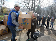 Locals accept humanitarian aid after the overnight Russian attack on Kharkiv, northeastern Ukraine. [PST110004370]