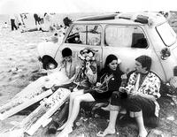 Hippies relaxing with flowers [PST110004381]