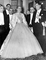 Eva Peron wearing a glamorous evening gown escorted by her husband, The President of Argentina. Pictured at Argentine's Independence Day "Gala Night" at Teatro Colon.  Buenos Aires - 30th May 1951 [PST110004382]