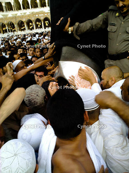 Muslims jostle for a chance to touch the black stone embedded in the eastern corner of the Kaaba, Grand Mosque, Mecca, Saudi Arabia. [PST110004337]