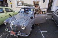 England, Hampshire, Alton, Vintage Car Rally, Bearded Gentleman with Vintage Austin Car [STV110083967]