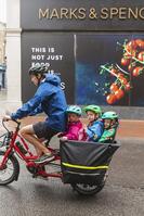 England, Hampshire, Winchester, The High Street, Street Scene with Cyclist with Children in Buggy [STV110084005]