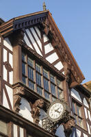 England, Hampshire, Winchester, The High Street, Historical Clock and Tudor Style Shop Facade now Boots the Chemist [STV110084071]