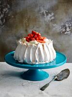 Strawberry covered pavlova on blue ceramic cake stand with cake server [TPG120056318]