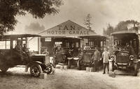 Four Model T Ford cars in the forecourt of the T.A.N. Motor Garage [TPG110085304]