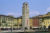 Low angle view of a clock tower in front of buildings, Aponale Tower, Riva del Garda, Italy [SPS110000025]