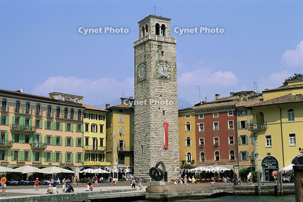 Low angle view of a clock tower in front of buildings, Aponale Tower, Riva del Garda, Italy [SPS110000025]