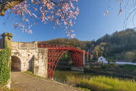 England, Shropshire, Telford, Ironbridge, Ironbridge Bridge, previously painted black, now in original red after 2018 restoration [AWL110001740]
