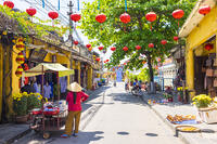 A Vietnamese woman with a food cart on the street in Hoi An Ancient Town, Hoi An, Quang Nam Province, Vietnam [AWL110001753]