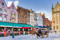 Tourists sitting in cafe on Bruges main square, Belgium [AWL110001901]
