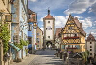 Historic houses and Spitaltor in Untere Schmiedgasse in the old town of Rothenburg ob der Tauber, Middle Franconia, Bavaria, Germany [AWL110001921]