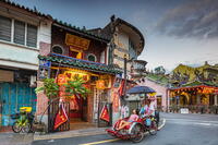 Female tourist on rickshaw in the streets of the old town, George Town, Penang, Malaysia [AWL110002024]
