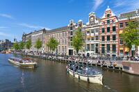 Boats passing by Institute for Advanced Study and Allard Pierson Museum of Antiquities on Rokin canal, Amsterdam, Netherlands [AWL110002040]