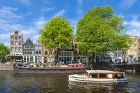 Boats and typical houses on Prinsengracht canal, Amsterdam, Netherlands [AWL110002043]