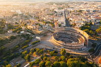 Aerial view of Colosseum and Roman forums at sunset. Rome, Lazio, Italy [AWL110002094]