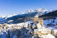 Aerial view of Tarasp castle after snowfall. Tarasp, Lower Engadine, Canton of Grisons, Switzerland, Europe. [AWL110002175]