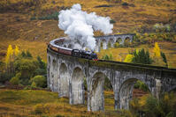 Jacobite steam train crossing Glenfinnan viaduct, Scottish Highlands, Scotland, UK [AWL110002250]