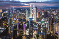 Aerial view of KLCC skyline with Petronas Twin Towers at twilight, Kuala Lumpur, Malaysia [AWL110002458]
