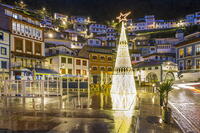 Night view of the main square adorned with Christmas tree, Cudillero, Asturias, Spain [AWL110002497]