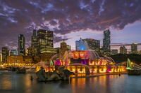Colored-light show at Buckingham Fountain with city skyline in the backdrop, Chicago, Illinois, USA [AWL110002530]