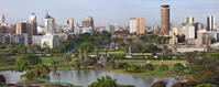 Kenya, Nairobi. A panoramic view of Nairobi in late afternoon sunlight with Uhuru Park in the foreground. [AWL110002583]
