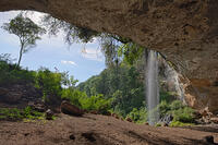 The attractive entrance to Makingeny cave where elephants come at night to eat salt by gouging the salt impregnated walls of the cave with their tusks. Kenya [AWL110002608]