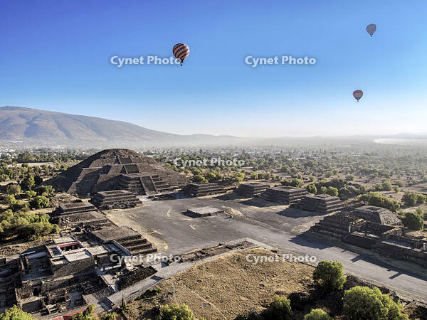 Hot air balloons flying over the Avenue of the Dead and the Pyramid of the Moon at sunrise, aerial view, Teotihuacan, Mexico State, Mexico [AWL110001691]