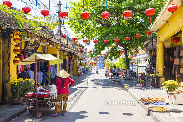 A Vietnamese woman with a food cart on the street in Hoi An Ancient Town, Hoi An, Quang Nam Province, Vietnam [AWL110001753]