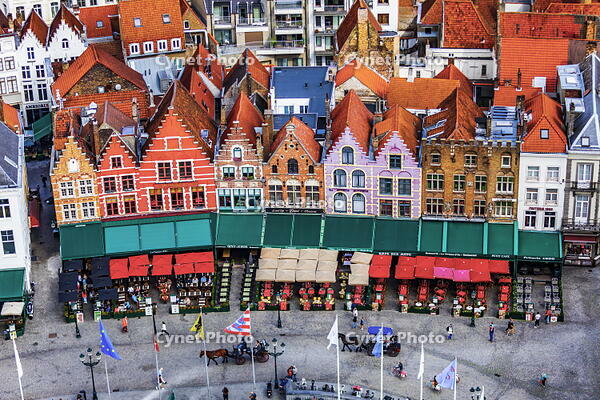 Belgium, West Flanders (Vlaanderen), Bruges (Brugge). Elevated view of the medieval guild houses and restaurants on Markt square [AWL110001902]
