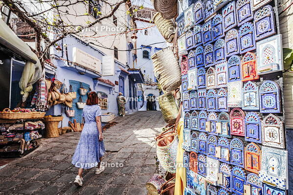 Woman walking along the souvenirs shops in the old town, Chefchaouen, Morocco [AWL110001956]