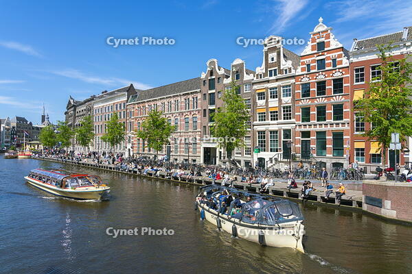Boats passing by Institute for Advanced Study and Allard Pierson Museum of Antiquities on Rokin canal, Amsterdam, Netherlands [AWL110002040]