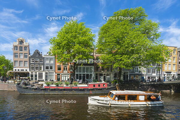 Boats and typical houses on Prinsengracht canal, Amsterdam, Netherlands [AWL110002043]