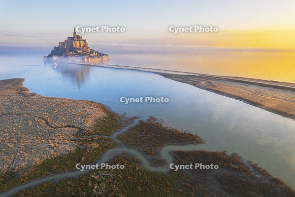 High tide surrounds Mont Saint-Michel at sunrise, aerial view, UNESCO World Heritage Site, Normandy, Manche, France [AWL110002088]