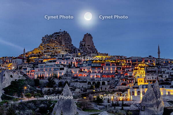 Moonlight over Uchisar Castle and village at dusk, Cappadocia, Nevsehir Province, Central Anatolia, Turkey [AWL110002118]