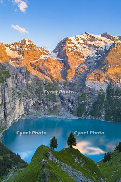 Aerial view of the sunset on the mountains surrounding Oeschinensee. Kandersteg, Bernese Oberland, Frutigen-Niedersimmental administrative district, Canton of Bern, Switzerland. [AWL110002141]