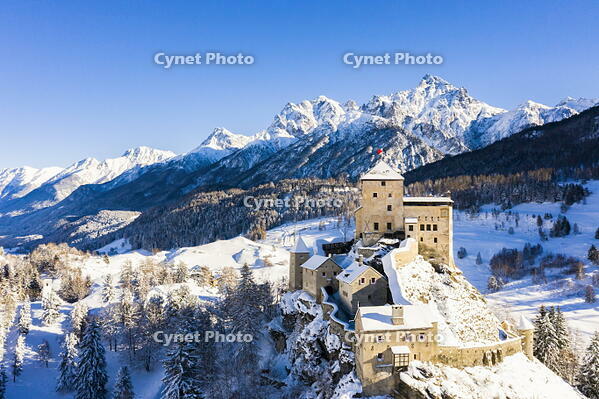 Aerial view of Tarasp castle after snowfall. Tarasp, Lower Engadine, Canton of Grisons, Switzerland, Europe. [AWL110002175]