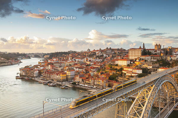 Porto at sunset with a train on Louis I8 bridge on Douro River. Oporto city, Porto district, Portugal, Europe [AWL110002234]