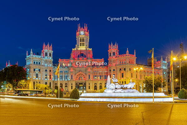 Cybele Palace or Palacio de Cibeles city hall illuminated by colors of Spanish flag, Plaza de Cibeles, Madrid, Community of Madrid, Spain [AWL110002496]