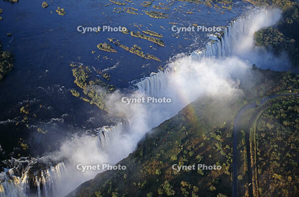 Zambia, Victoria Falls. Aerial view of the Zambezi River as it plummets over the Victoria Falls, which span the border between Zambia and Zimbabwe [AWL110002586]