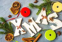 Christmas concept with gift boxes, ribbon and cones on rustic concrete background with copyspace [IBR123380124]