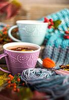 Autumnal concept with cup of tea with lemon, cinnamon stick and anise star on rustic wooden background full of bright yellow leaves [IBR123380129]